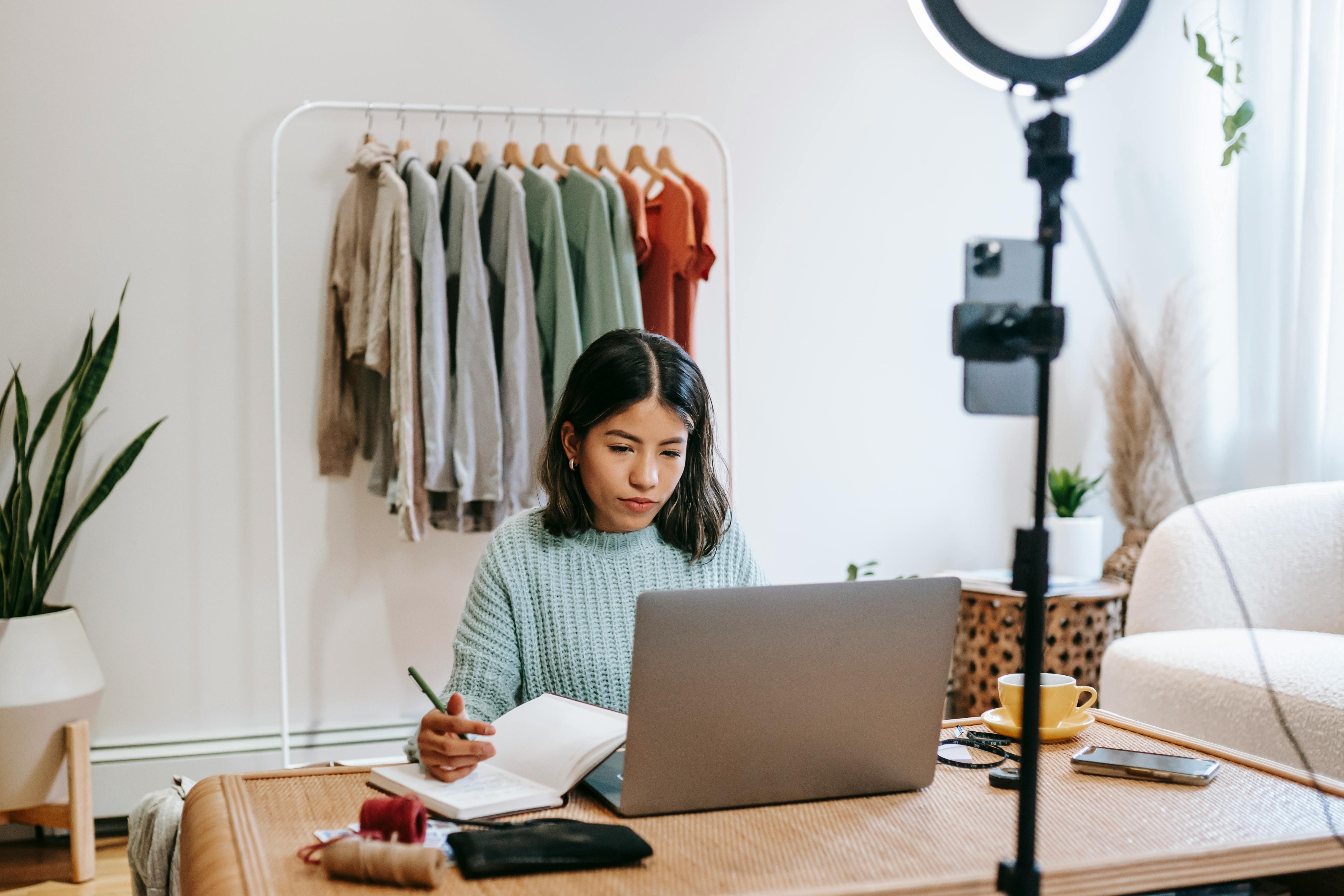 Focused business owner working on laptop at home